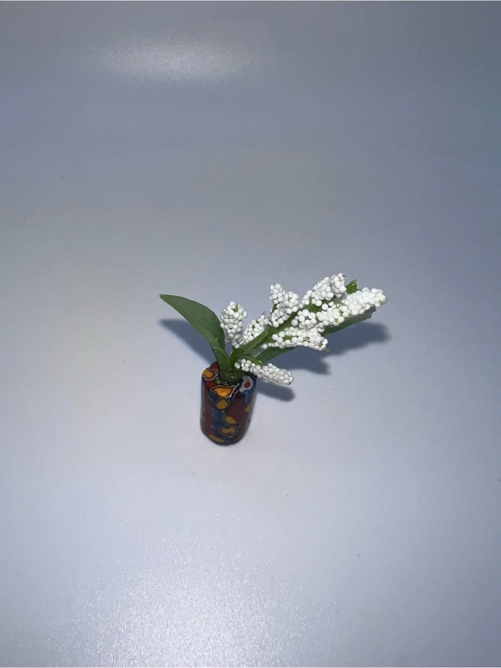 Miniature Decorative Vase with White Floral Spray